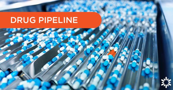 Drug Pipeline – Blue pills traveling through a sorting machine, a red pill stands out from the rest.