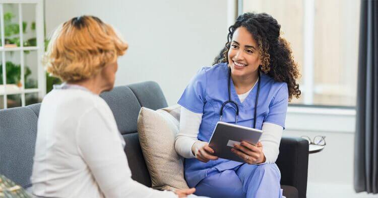 A nurse chatting with patient