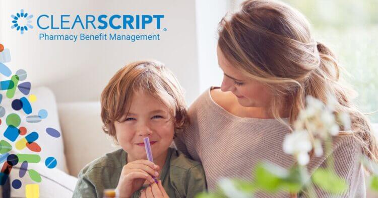 mom and son holding medication, seated